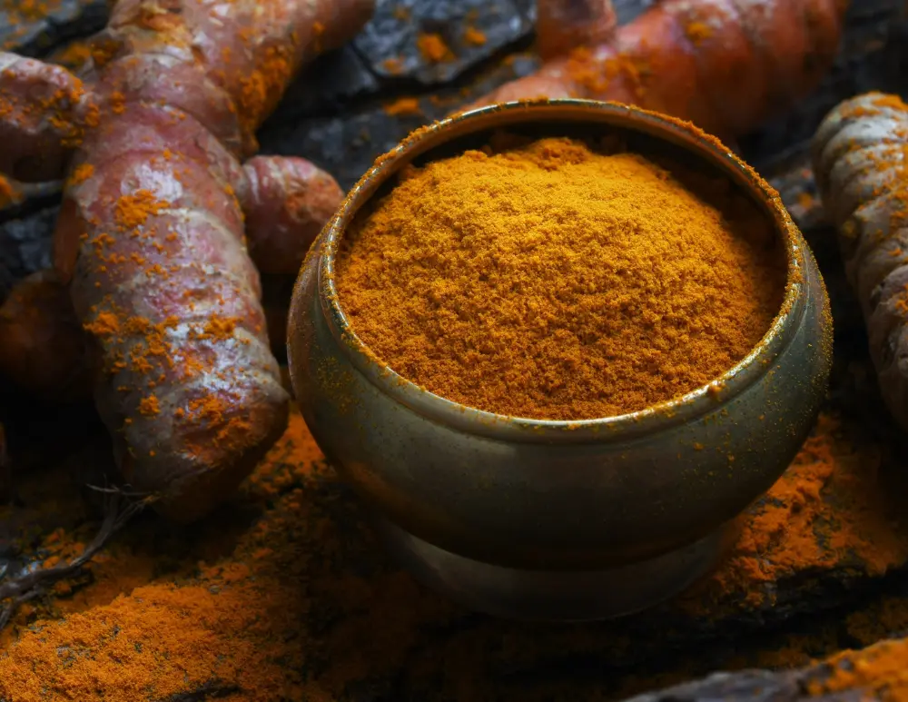 Turmeric is used in its whole form as a spice, while curcumin is the key active compound known for its potent health advantages.